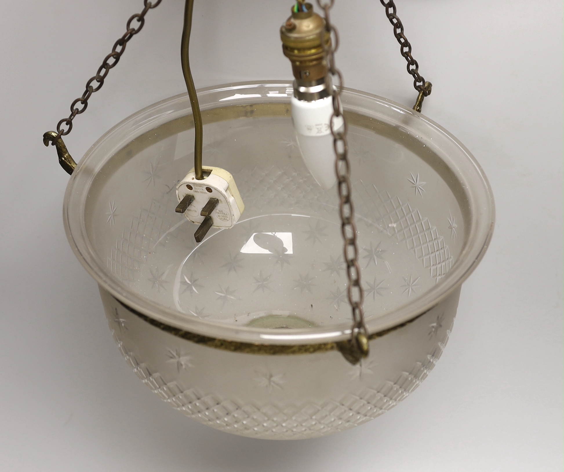 A gilt brass and frosted glass ceiling dome, the brass mounts cast with flowers, 36cm in diameter